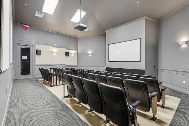 cinema with light carpet and crown molding