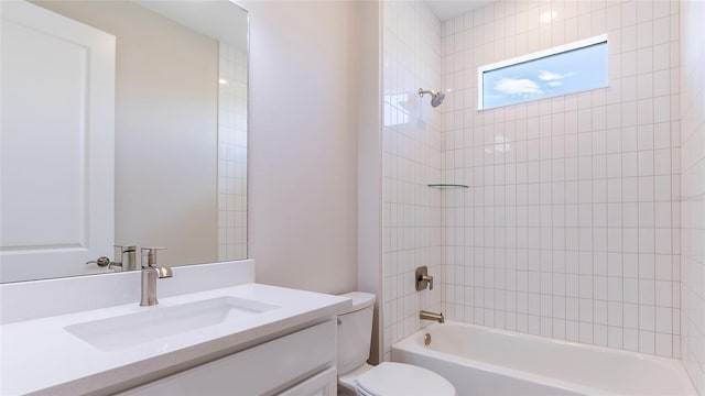 full bathroom with vanity, toilet, and tiled shower / bath combo