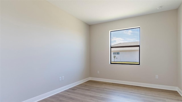 unfurnished room featuring light wood-type flooring