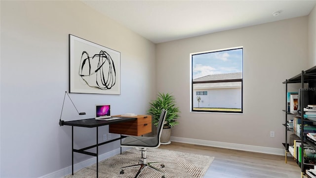 home office featuring light hardwood / wood-style floors