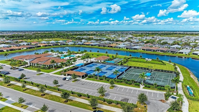 birds eye view of property with a water view