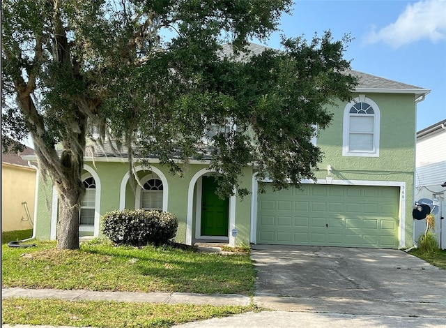 obstructed view of property featuring a garage