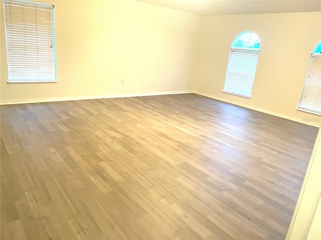 spare room featuring hardwood / wood-style floors