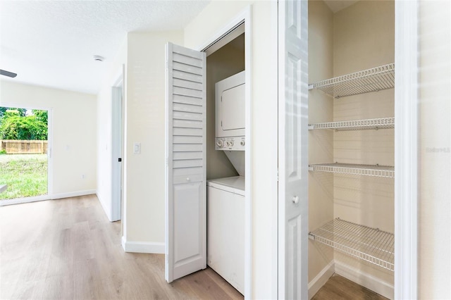 interior space with stacked washer and dryer
