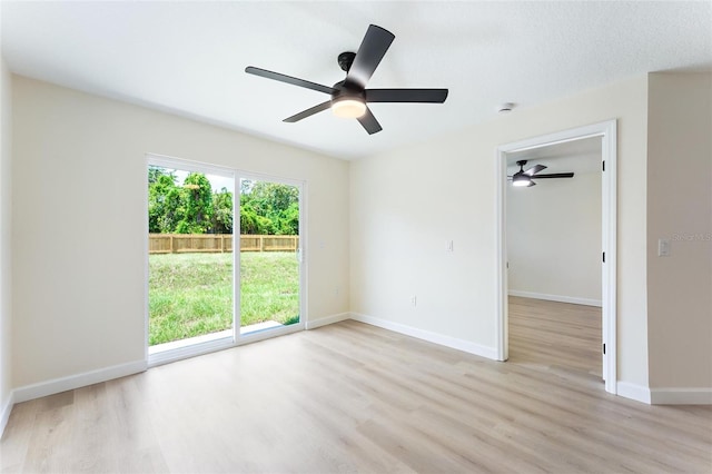 spare room with ceiling fan and light hardwood / wood-style flooring