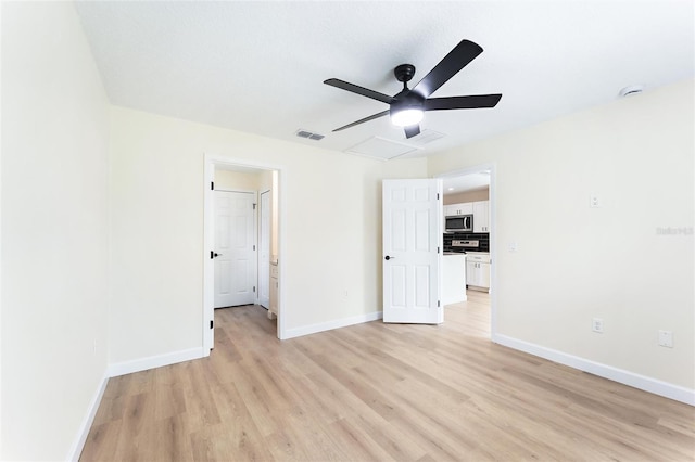 unfurnished bedroom featuring ceiling fan and light wood-type flooring