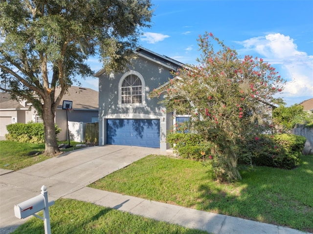 view of front facade with a front lawn and a garage