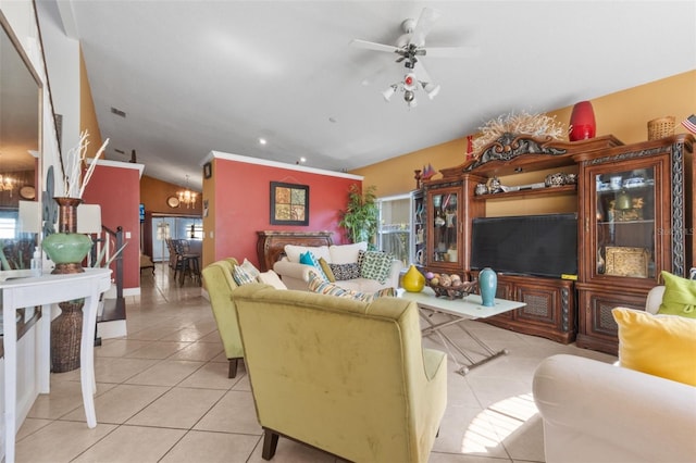 living room with light tile patterned floors and ceiling fan with notable chandelier