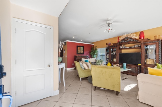 tiled living room with ceiling fan