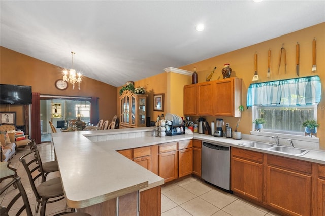 kitchen with stainless steel dishwasher, sink, kitchen peninsula, and lofted ceiling