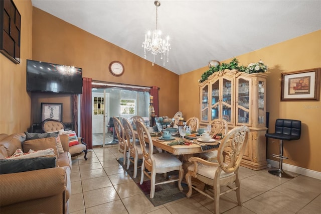 dining room featuring lofted ceiling, a chandelier, and light tile patterned floors