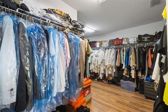 walk in closet featuring hardwood / wood-style flooring