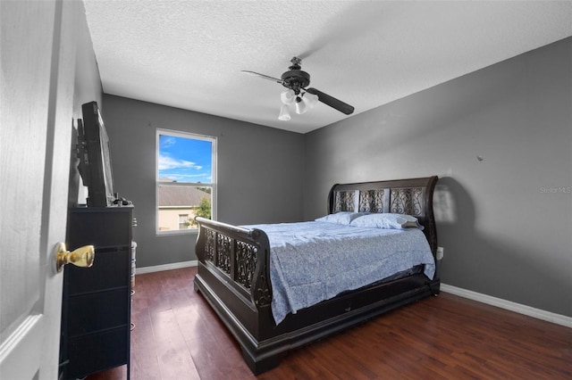 bedroom featuring a textured ceiling, ceiling fan, and hardwood / wood-style floors