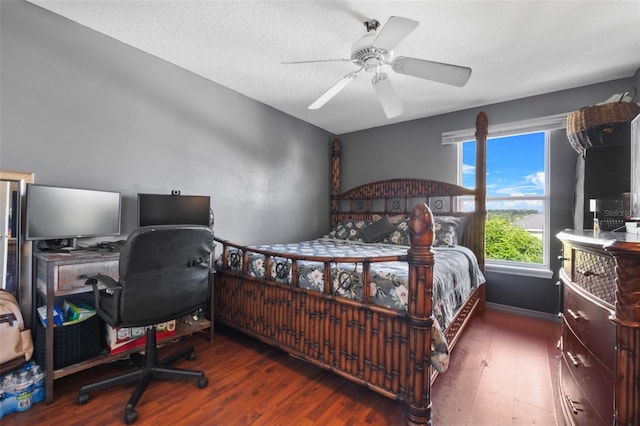 bedroom featuring a textured ceiling, ceiling fan, and wood-type flooring