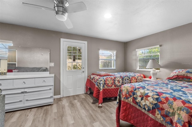 bedroom featuring ceiling fan and light wood-type flooring