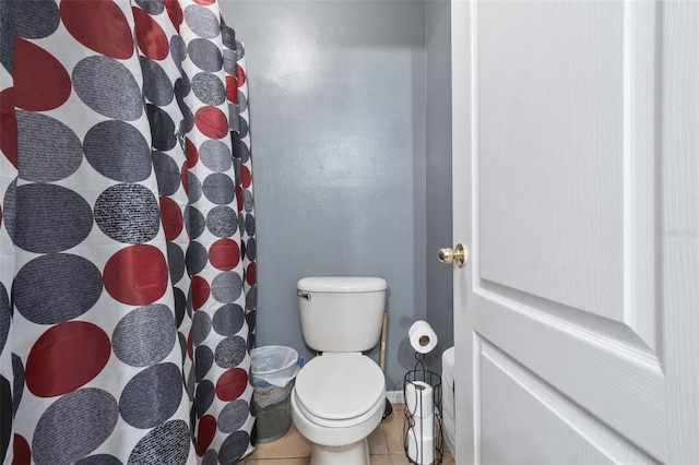 bathroom with toilet and tile patterned floors