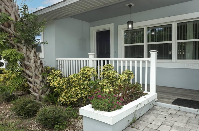 doorway to property featuring a porch