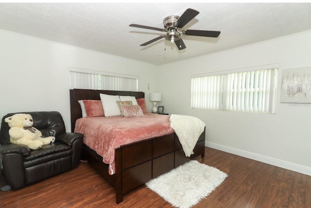 bedroom featuring ceiling fan, crown molding, and wood-type flooring