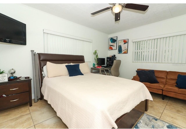 tiled bedroom featuring ceiling fan