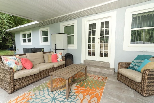 exterior space featuring an outdoor living space, french doors, and cooling unit