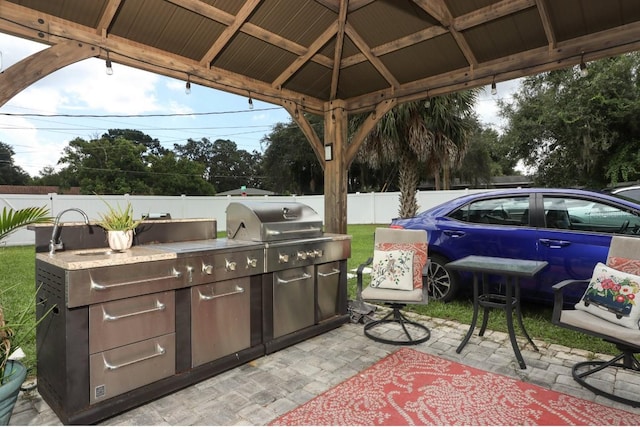 view of patio / terrace with a gazebo and a grill