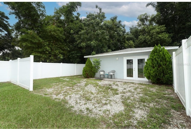 view of yard with french doors