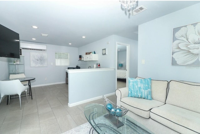 living room with light tile patterned floors and a wall mounted air conditioner