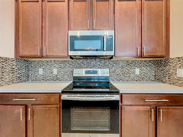 kitchen featuring appliances with stainless steel finishes and backsplash