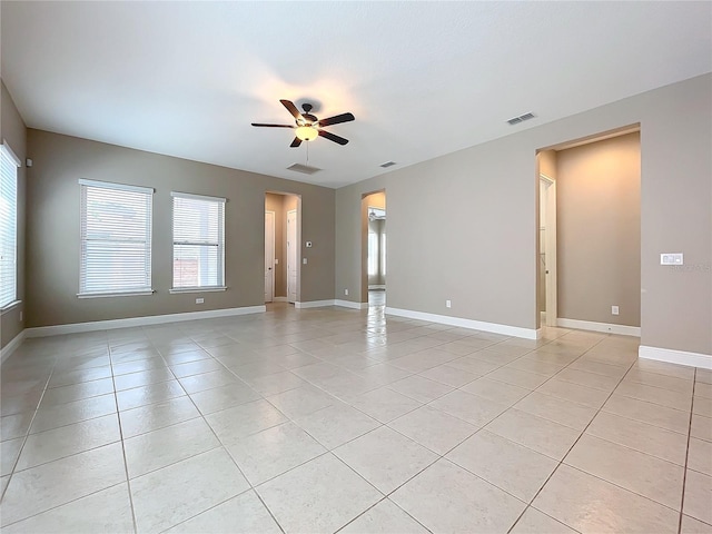 unfurnished room featuring ceiling fan and light tile patterned floors