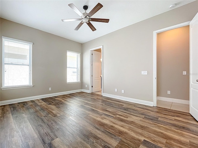 unfurnished room featuring ceiling fan and wood-type flooring