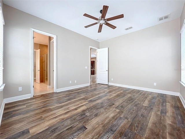 interior space with ceiling fan and wood-type flooring