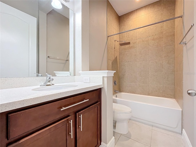 full bathroom with toilet, tiled shower / bath, vanity, and tile patterned floors