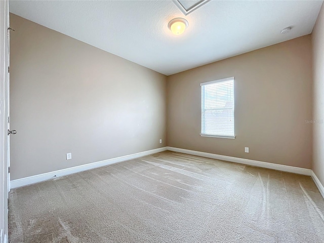 unfurnished room with carpet floors