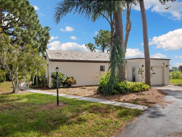 view of side of home with a garage