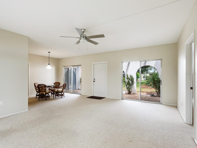 carpeted empty room with ceiling fan