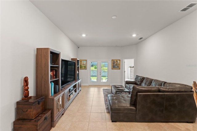 living room with french doors and light tile patterned floors