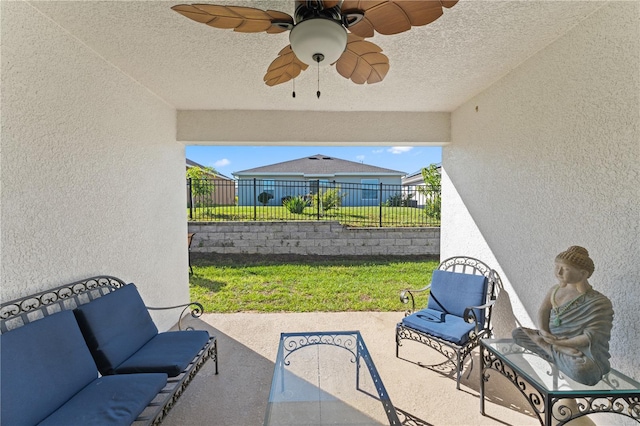 view of patio featuring ceiling fan