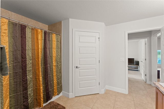 bathroom with tile patterned flooring