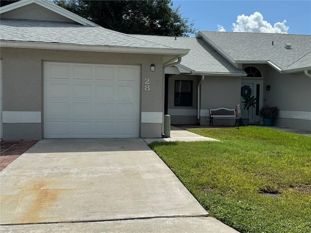 view of front of house with a front lawn and a garage