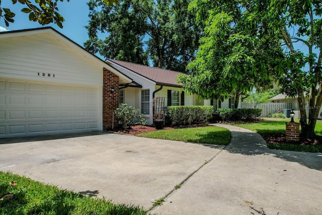 single story home featuring a garage