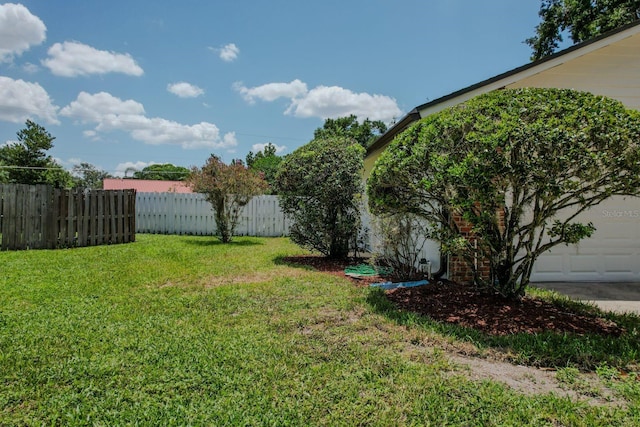 view of yard featuring a garage