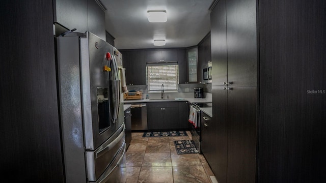 kitchen with sink and appliances with stainless steel finishes