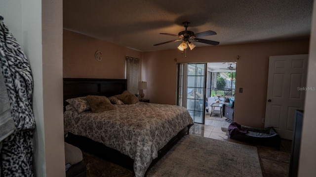 bedroom with access to exterior, ceiling fan, and a textured ceiling