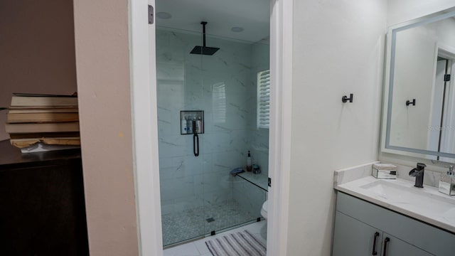 bathroom featuring tile patterned flooring, vanity, toilet, and an enclosed shower