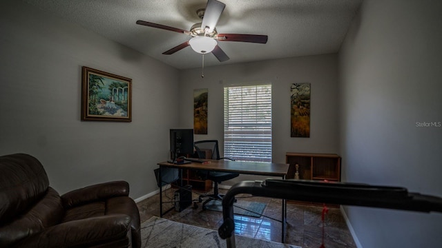 home office with ceiling fan and a textured ceiling