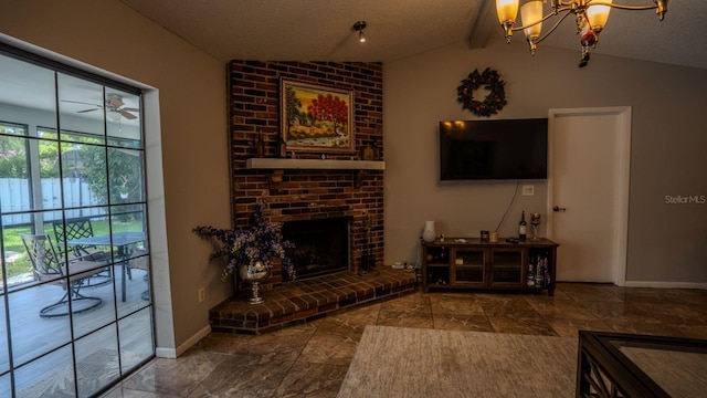 living room featuring a fireplace, a textured ceiling, lofted ceiling with beams, and ceiling fan with notable chandelier