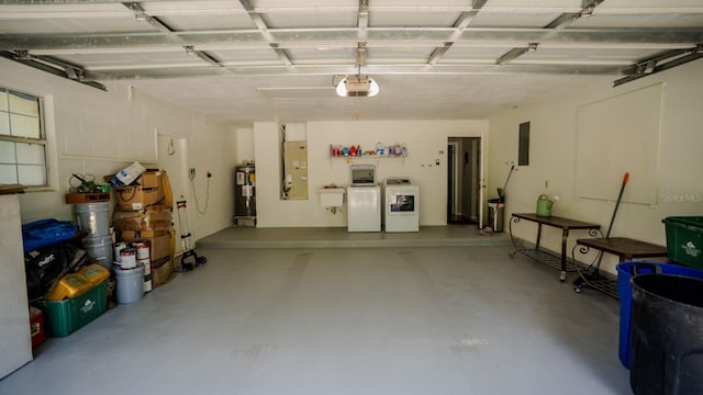 garage with sink, electric water heater, white refrigerator, a garage door opener, and washer and dryer