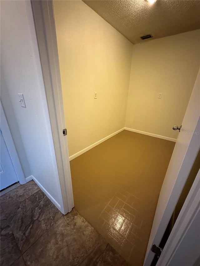 interior space with a textured ceiling