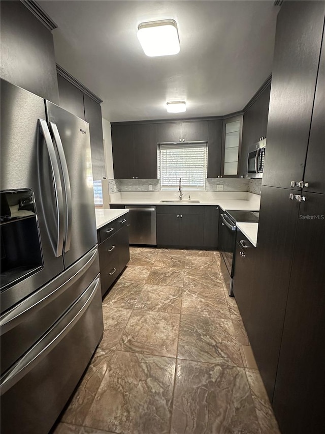 kitchen with sink and appliances with stainless steel finishes