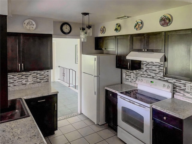 kitchen featuring decorative light fixtures, decorative backsplash, sink, light tile patterned floors, and white appliances